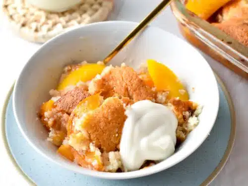 This Peach Cobbler with cake mix is the easiest dessert you will ever make. Plus, you don't need eggs or fancy ingredients to make this easy cobbler recipe, and barely 10 minutes to put together.