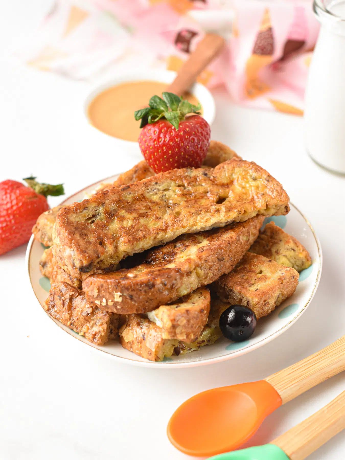 a plate filled with french toast sticks for baby led weaning