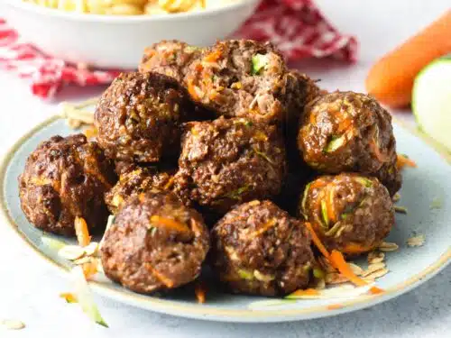 These Meatballs for dogs are easy healthy meatballs for your furry pet. They are packed with vegetables, lean ground meat, and fiber from oats.